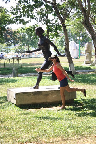 Lina posing with the running woman statue