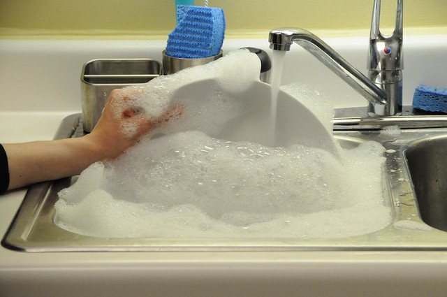 Washing the dishes with soap