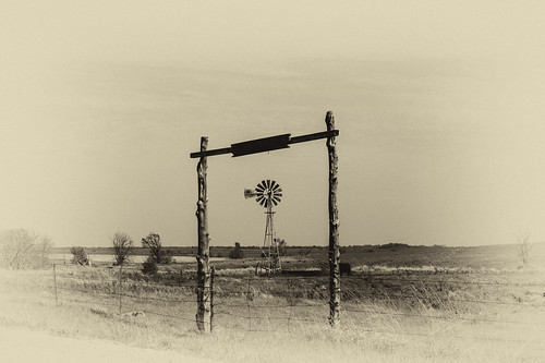 trees sky windmill sepia fence landscape gate horizon pasture