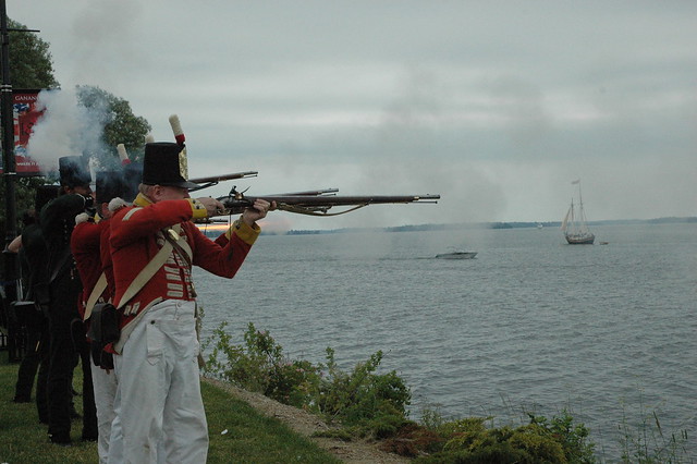 Muskets fire as part of the musket volley and cannon salute from the Canadian Regiment of Fencible Infantry and the Royal Navy Gun Crew and Royal Artillery. (Photos Courtesy: Rosanne Lake, GananoqueToday.ca)