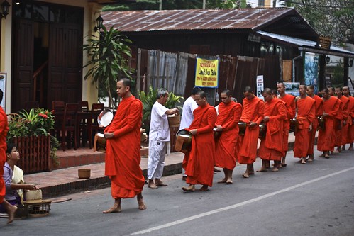 Monks gather alms outside of our guesthouse in the morning