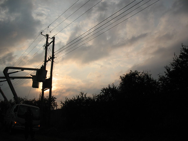 Electrician Servicing a Power Line