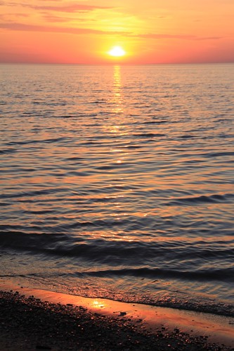 pink blue sunset sky orange sun lake beach water yellow sand rocks waves calm serene lakehuron pinery mikenits