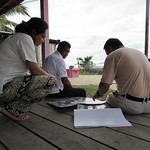 Showing Posters to the Villagers