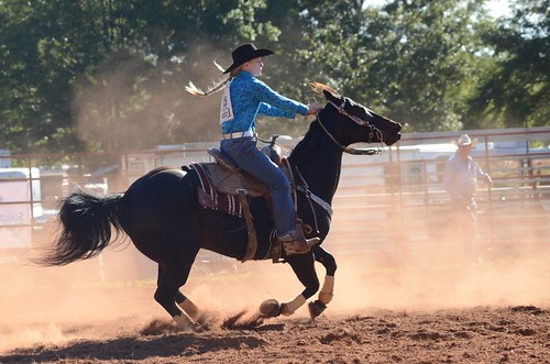 rodeo cowgirl polebending dust cowboy horse