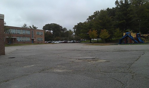 Cross Country Elementary School before the enhancements. Covered in blacktop.