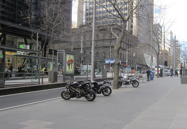 Motorbike parking, out of the way, opposite a tram superstop