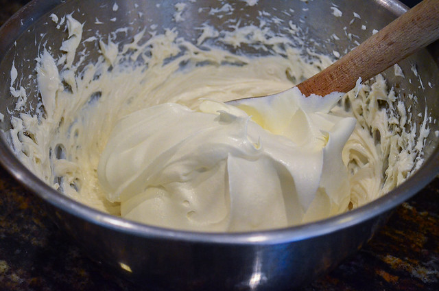 The cream cheese mixture being mixed together in a bowl.