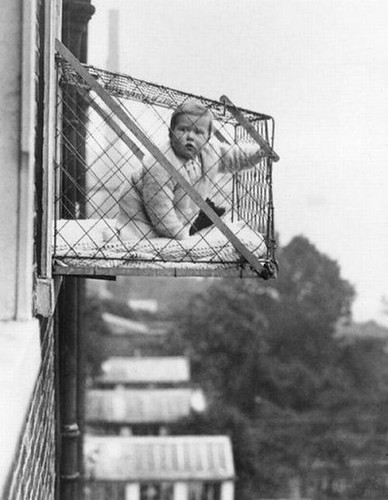 How could parents ensure that their children were getting sunlight and fresh air when living in apartment buildings - the baby cage ca 1937