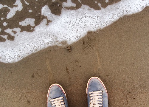 statutory feet on beach shot