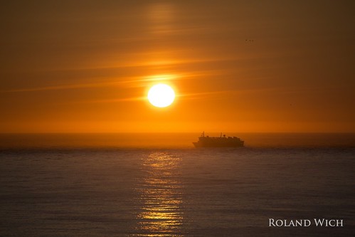 ìsland island iceland westfjords latrabjarg midnight sun ship sunset