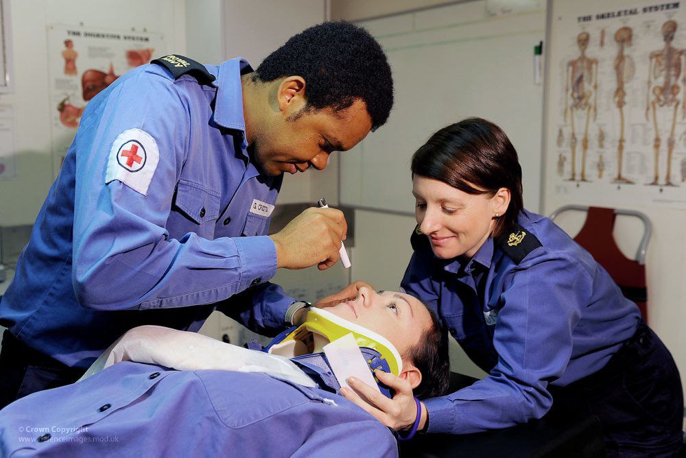 Royal Navy Medics Treating a Patient