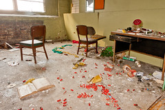 Trashed office. The red things are some sort of plastic wire caps - not shotgun shells.  Abandoned Barber-Colman factory in Rockford, Illinois