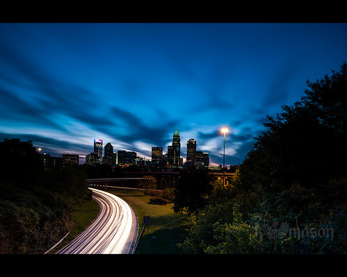 blue sunset red sky white building cars skyline night clouds landscape nc highway energy downtown cityscape charlotte northcarolina duke headlights hour lightstream nikonwideanglepcenikkor24mmf35ded