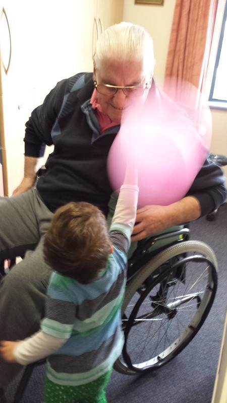 Whacking Poppy Boney in the nose with a balloon