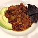 Chili with avocado and blue corn chips