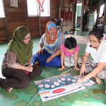 Showing Posters to the Villagers 2