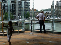 Young and elder visitors in one of the light corners of museum MAS - Museum aan de Stroom - with a view over the old waterfront; outside the city-center of Antwerp.  photography of modern architecture in the urban city - Fons Heijnsbroek, Antwerp 2012