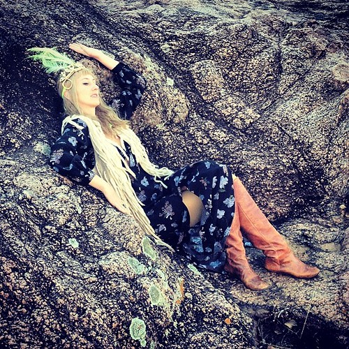 Elf Queen lounging on a throne of granite.