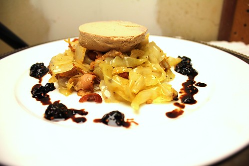 Duck foie gras with bacon and juniper-flavored cabbage and blackberry mustard seed gastrique