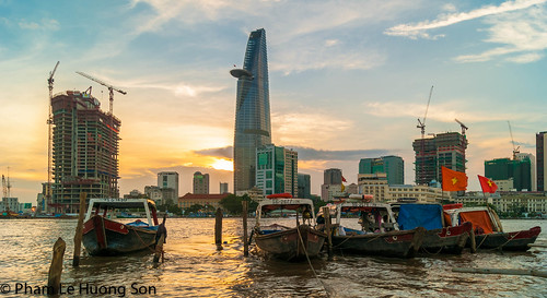 life street city travel blue sunset sky urban reflection building tower water retail skyline architecture modern night clouds skyscraper sunrise river asian boats dawn harbor boat canal office cosmopolitan colorful asia downtown vietnamese cityscape dusk culture landmarks bank center scene panoramic structure vietnam business exotic commercial coastline riverbank saigon hochiminhcity channel locations prosperity finance indochina