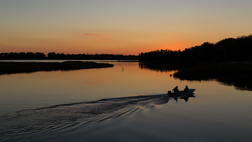 sunset reflection water boat fishing wake peaceful