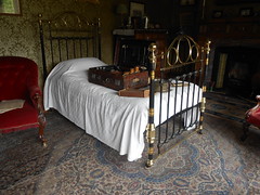 Lanhydrock. Victorian brass bed.