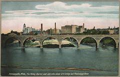 'Minneapolis, Minn., the Milling District, east side mills, Stone Arch Bridge and Mississippi River'  / postcard