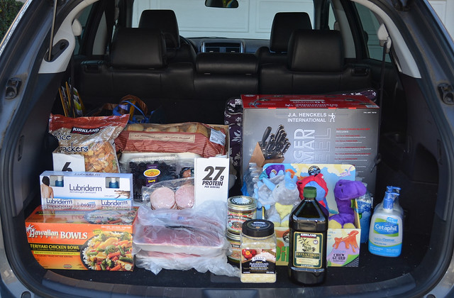 An open car trunk filled with groceries.