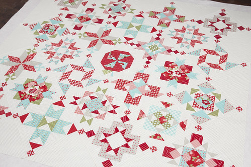 2012 Designer Mystery block of the month quilt by Fat Quarter Shop. PDF patterns available for 12 block patterns + the finishing kit. Fabric is Vintage Modern by Bonnie & Camille or Moda Fabrics.