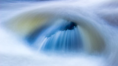 The eye | Water flows over a rock