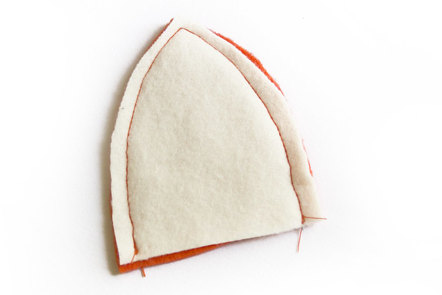 sew both curved edges of ears