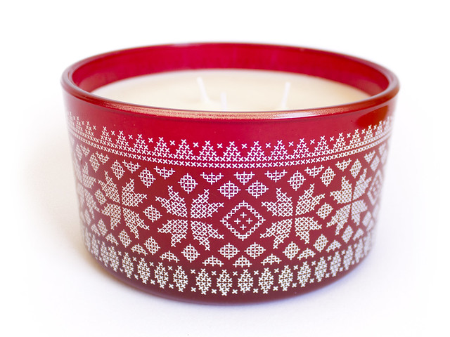 Candle with nordic cross stitch motifs