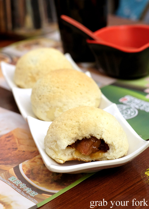 Inside the baked barbecue pork bun at the Michelin-starred Tim Ho Wan, Sham Shui Po, Hong Kong