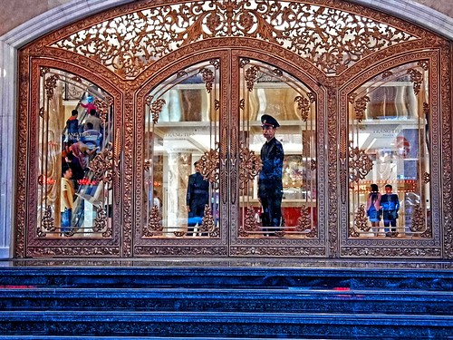 life street blue people stairs reflections mall shopping gold glasses escalator vietnam hanoi doorman