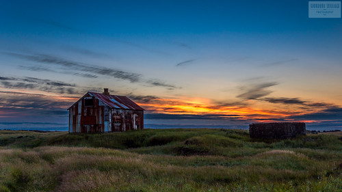 old blue roof sunset sky cloud sun house green grass yellow metal rural iceland rust ruins iron straumsvik