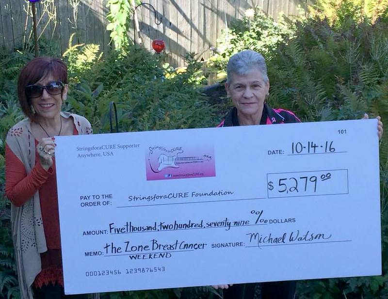 StringsforaCURE executive director Elisa Guida with check from 11th annual Zone Breast Cancer Awareness Weekend