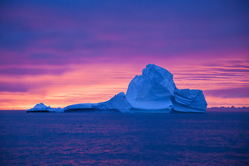 Sunset behind icebergs