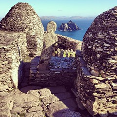 Atop Skellig Michael, a 6th century monastic settlement on a rock island off the coast of Portmagee, County Kerry. Ancient burial cross and 'Small Skellig' bird sanctuary island in the background. Absolutely remarkable spot, crystal weather to boot. #dn