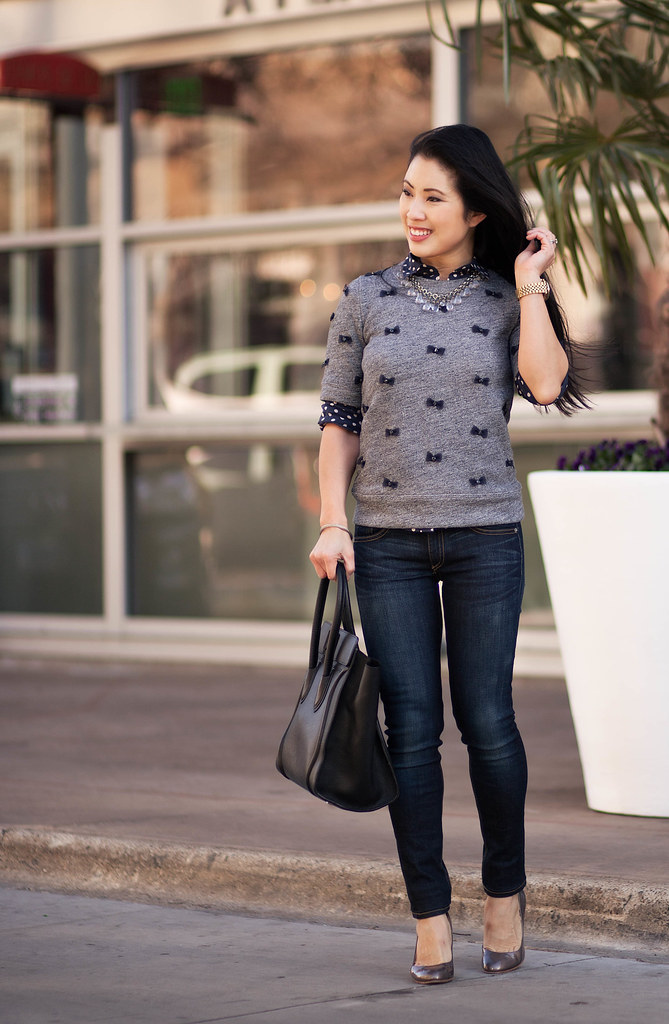 cute & little blog | polka dot shirt, mini bows sweater, rag and bone skinny jeans, statement necklace, celine | layers outfit