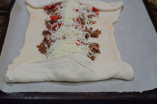Dough is folded over ingredients.