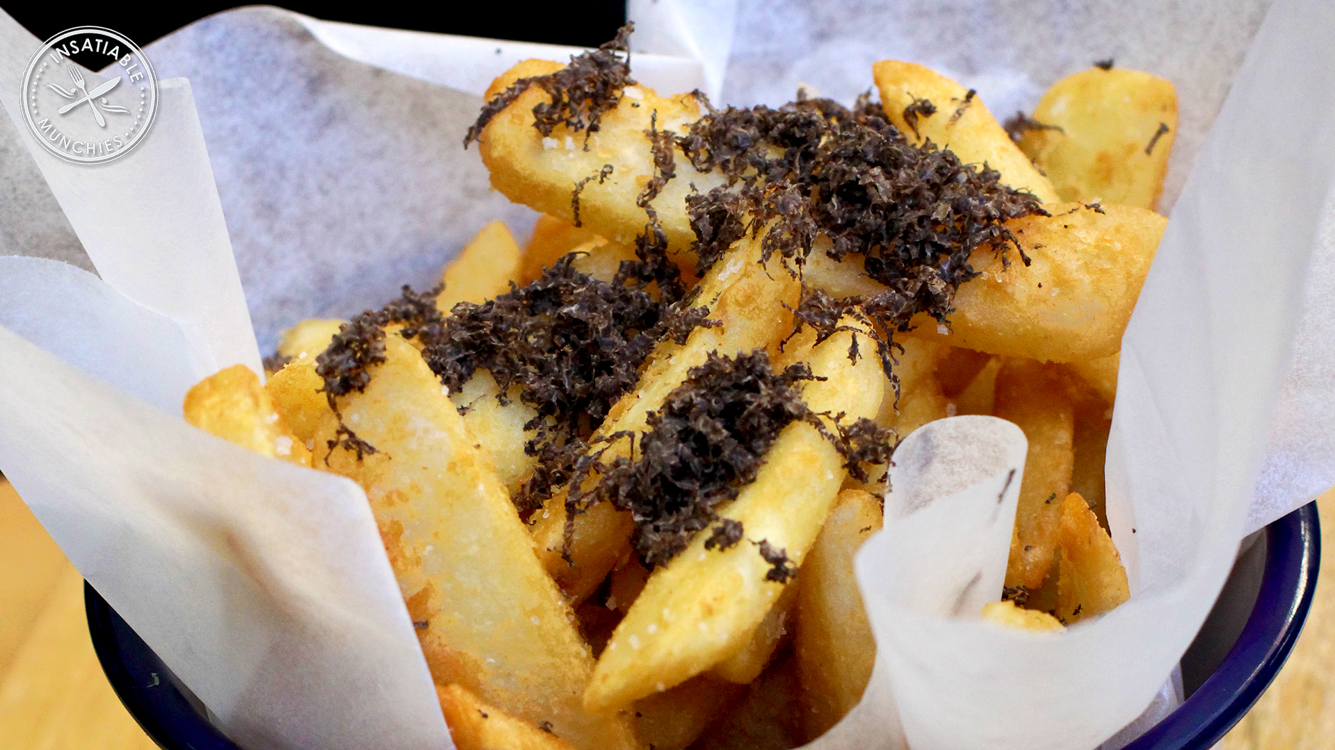 Golden fries, topped with freshly shaved truffles