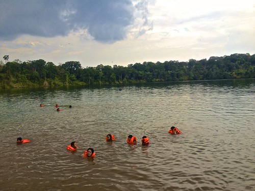 Cambodians "swimming" in Yeak Laom volcanic crater lake. Pretty much everyone on the lake was wearing a life jacket.