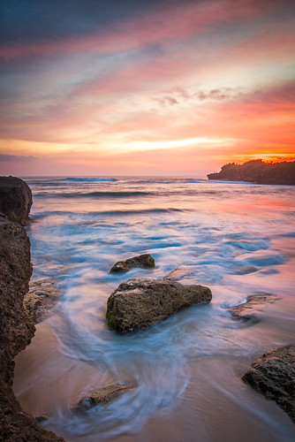 sunset bali beach indonesia rocks surf nusalombongan