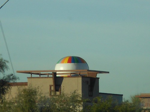 Only recently have I realized that the dome like object on the other side of a post-modern house is, most likely, a further away hot air balloon.