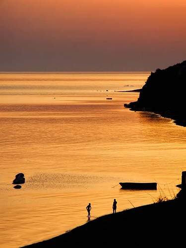 sunset sea summer two sky people color colour silhouette rock vertical coast boat horizon land fujifilm albania seashore durres finepixs9600 goldsea lalez august52012 lalezibay