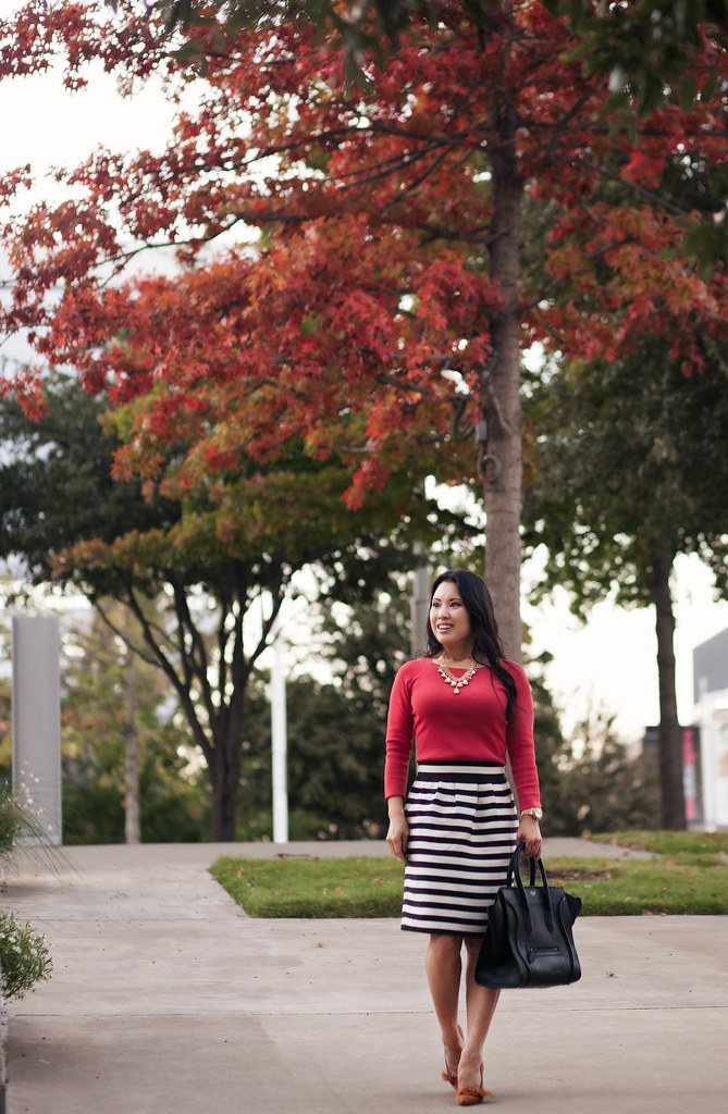 cute & little blog | fall colors outfit | red-orange top, black white striped skirt, sole society elisa, gold jewel statement necklace, celine mini luggage tote