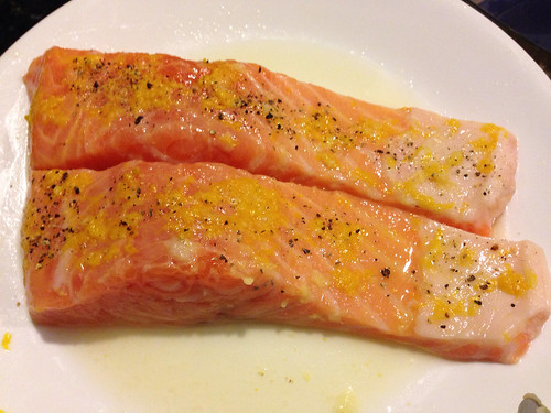 Salmon prepped for the broiler with side pocket's lemon zest on top.