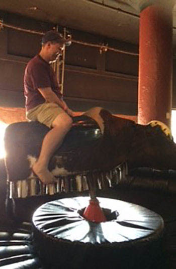 Riding the mechanical bull at the Bourbon Barrel