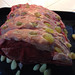 Prime rib studded with garlic cloves, ready for roasting